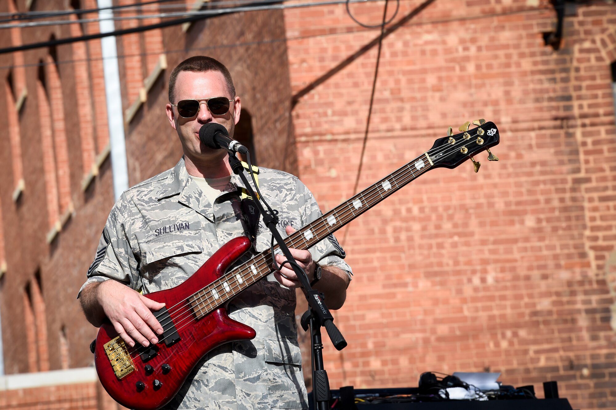 Master Sgt. Eric Sullivan, United States Air Force Band’s Celtic Aire vocalist and bassist, sings “Galway Girl” during a performance at the Wichita Falls Irish Street Festival in Wichita Falls, Texas, March 12, 2016. The band is the premier Celtic and folk ensemble of the U.S. Air Force Band. (U.S. Air Force photo by Senior Airman Ryan J. Sonnier/RELEASED)