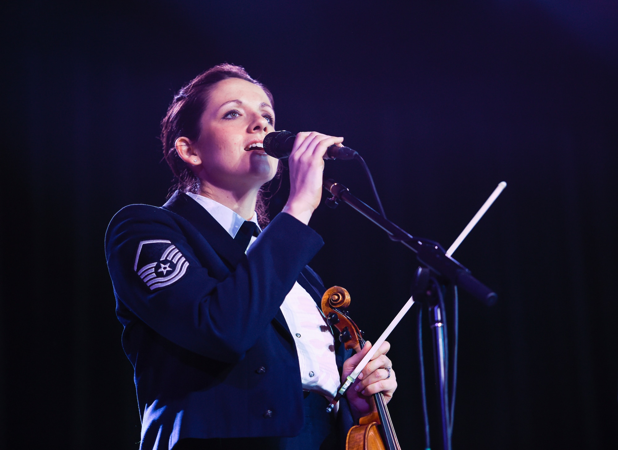 Master Sgt. Emily Wellington, United States Air Force Band’s Celtic Aire vocalist and violinist, sings an Irish song during a Celtic Aire performance at the Hippodrome Theatre in Waco, Texas, March 7, 2016. The band is the premier Celtic and folk ensemble of the U.S. Air Force Band. (U.S. Air Force photo by Senior Airman Ryan J. Sonnier/RELEASED)