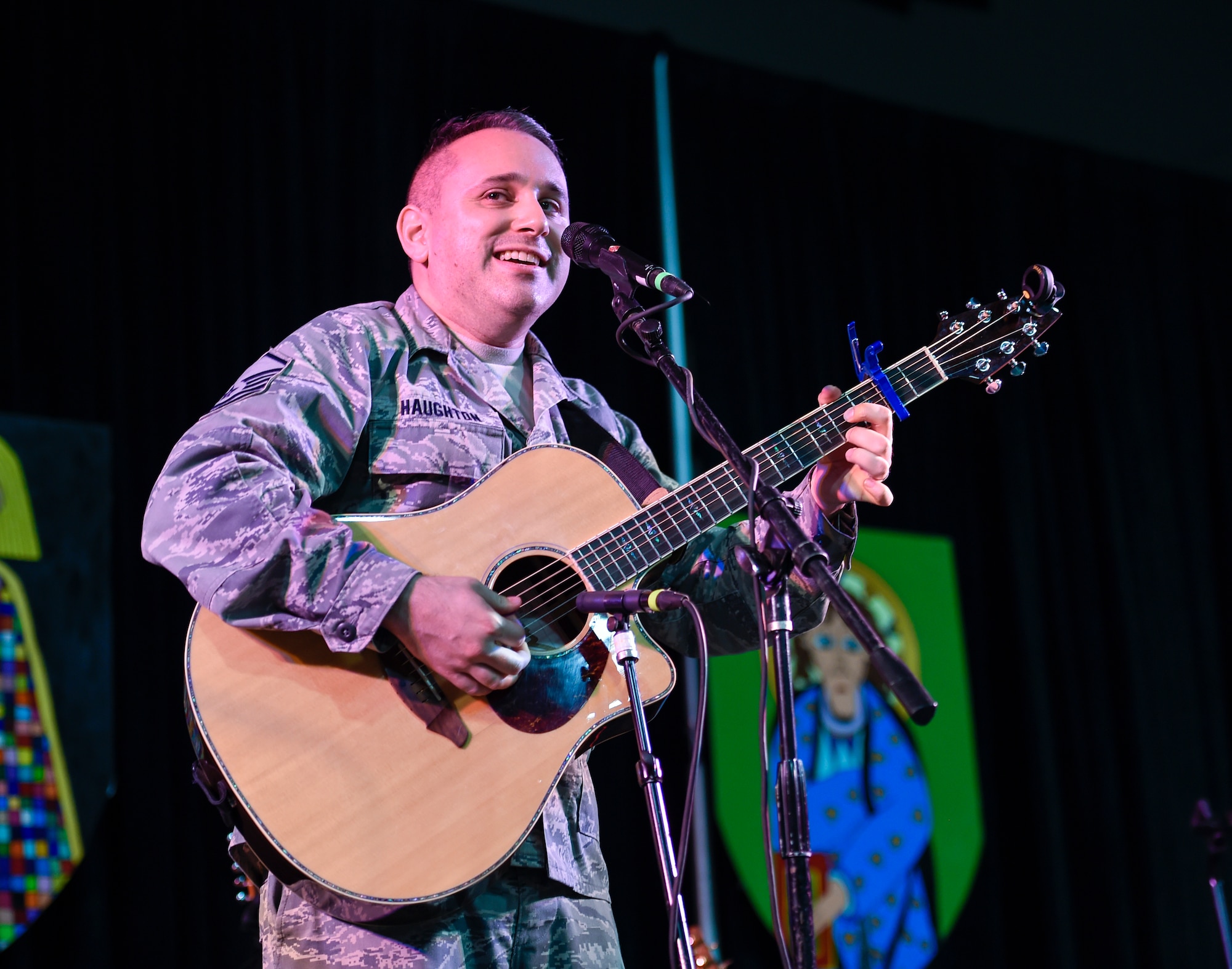 Master Sgt. Joseph Haughton, United States Air Force Band’s Celtic Aire vocalist and guitarist, plays an Irish song during a performance at the North Texas Irish Festival in Dallas, Texas, March 6, 2016. The band is the premier Celtic and folk ensemble of the U.S. Air Force Band. (U.S. Air Force photo by Senior Airman Ryan J. Sonnier/RELEASED)