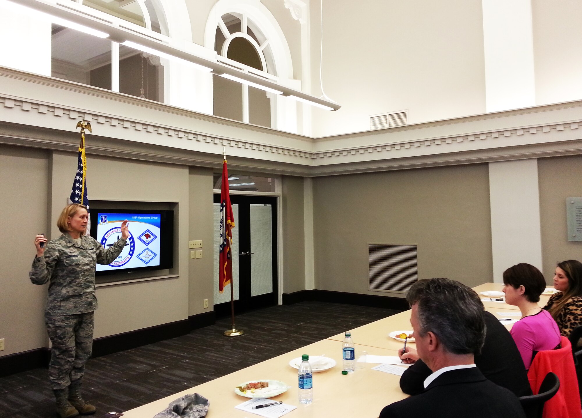 Col. Bobbi Doorenbos, 188th Wing commander, speaks to area company human resource professionals at the Fort Smith Regional Chamber of Commerce March 10. The objective of the meeting was to educate local companies on a partnership initiative between the 188th and the Chamber of Commerce. The strategy focuses on linking drill-status Guardsmen with full-time employment opportunities in the River Valley. The meeting educated local employers on specific training and education 188th members receive and how those specialties can benefit the local civilian workforce. (U.S. Air National Guard photo by Maj. Heath Allen/Released)