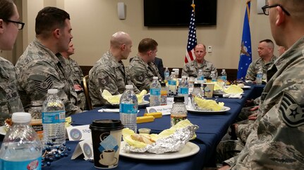 U.S. Air Force Lt. Gen. Stephen W. Wilson (center right), U.S. Strategic Command (USSTRATCOM) deputy commander, discusses deterrence, leadership and technology with noncommissioned officers from the 92nd and 141st Air Refueling Wings during breakfast at Fairchild Air Force Base, Wash., March 14, 2016. Wilson and Mr. W. Gary Gates (not pictured), Strategic Command Consultation (SCC) Committee member, visited Fairchild to present the 2015 Omaha Trophy, strategic aircraft category, to the 92nd Air Refueling Wing on behalf of USSTRATCOM and the SCC. The Omaha Trophy, which dates back to the U.S. Air Forceâ€™s Strategic Air Command, was originally created by the SCC in 1971. At the time, a single trophy was presented annually as a token of appreciation to USSTRATCOMâ€™s best wing. Since then, the tradition has evolved to unit-level awards that recognize the commandâ€™s premier intercontinental ballistic missile (ICBM) wing, ballistic missile submarine, strategic bomber wing and global operations (space/cyberspace) unit. This year, a new category was added to include the combatant commandâ€™s top strategic aircraft wing. (USSTRATCOM photo by Dave Wells)  Story Available : https://www.stratcom.mil/news/2016/595/-/