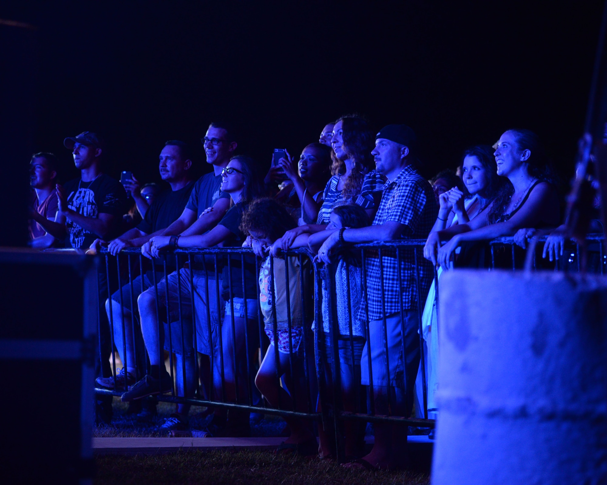 An audience listens to the Brothers Osborne performance March 12, 2016, at Andersen Air Force Base, Guam. The band received a 2016 Grammy Award nomination for their song “Stay a Little Longer.” (U.S. Air Force photo/ Airman 1st Class Jacob Skovo)