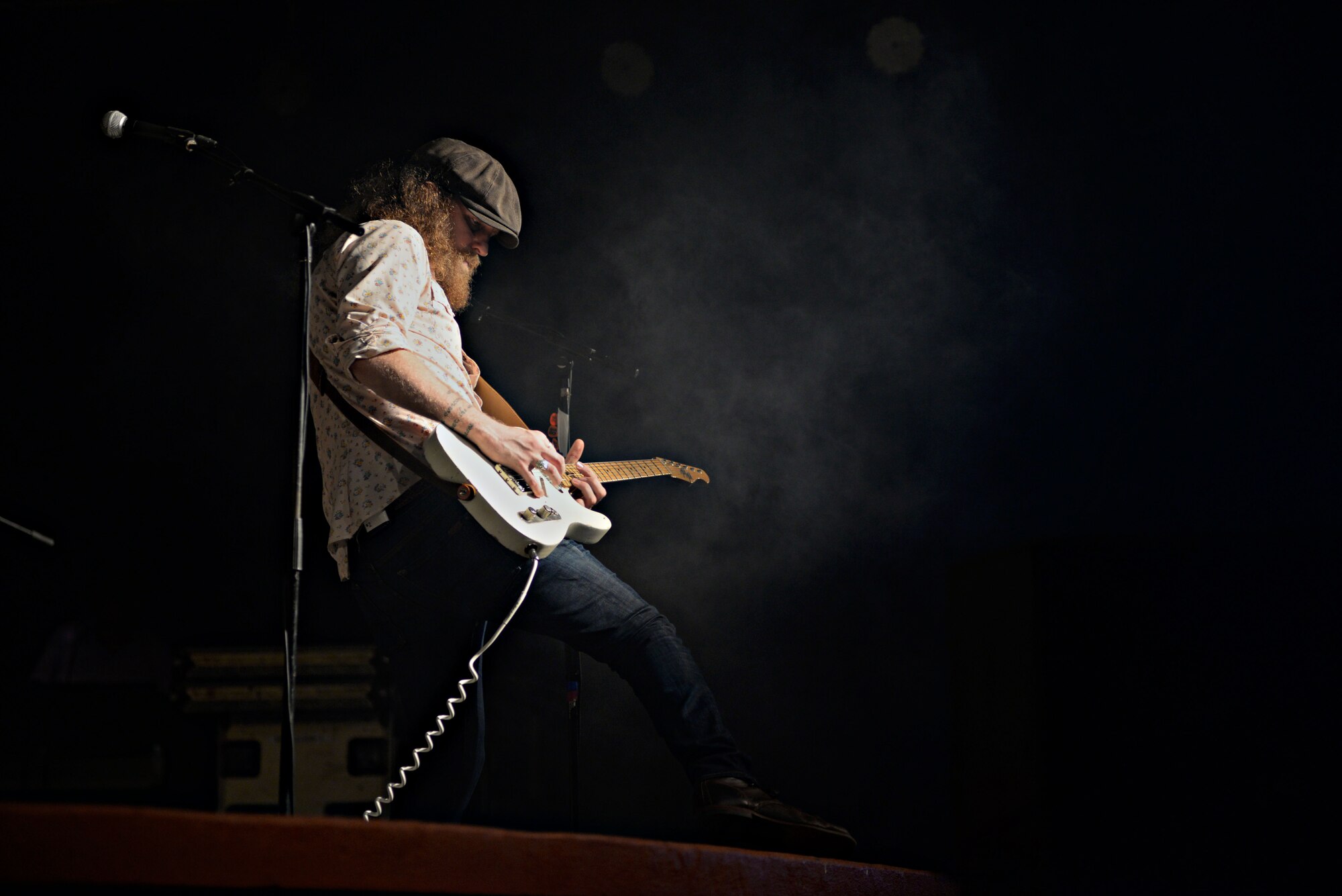 John Osborne, Brothers Osborne lead guitarist, plays a guitar solo during a concert March 12, 2016, at Andersen Air Force Base, Guam. While on Guam, the band played two concerts on Andersen AFB and U.S. Naval Base Guam. (U.S. Air Force photo/ Airman 1st Class Jacob Skovo)