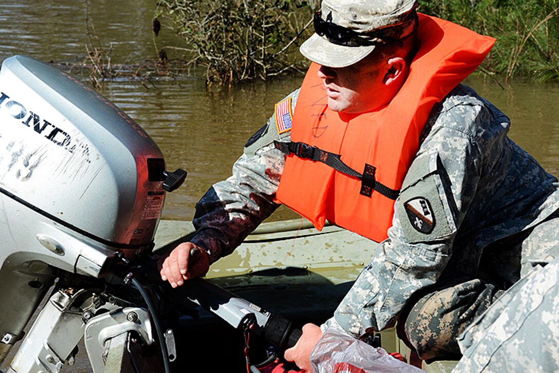 Army Staff Sgt. Ruben Mullins starts his flat-bottom boat to prepare for a rescue mission in high waters east of Ponchatoula, La., March 13, 2016. Mullins is assigned to Louisiana Army National Guard’s Detachment 1, 843rd Horizontal Engineer Company. Army National Guard photo by 1st Sgt. Paul Meeker 
