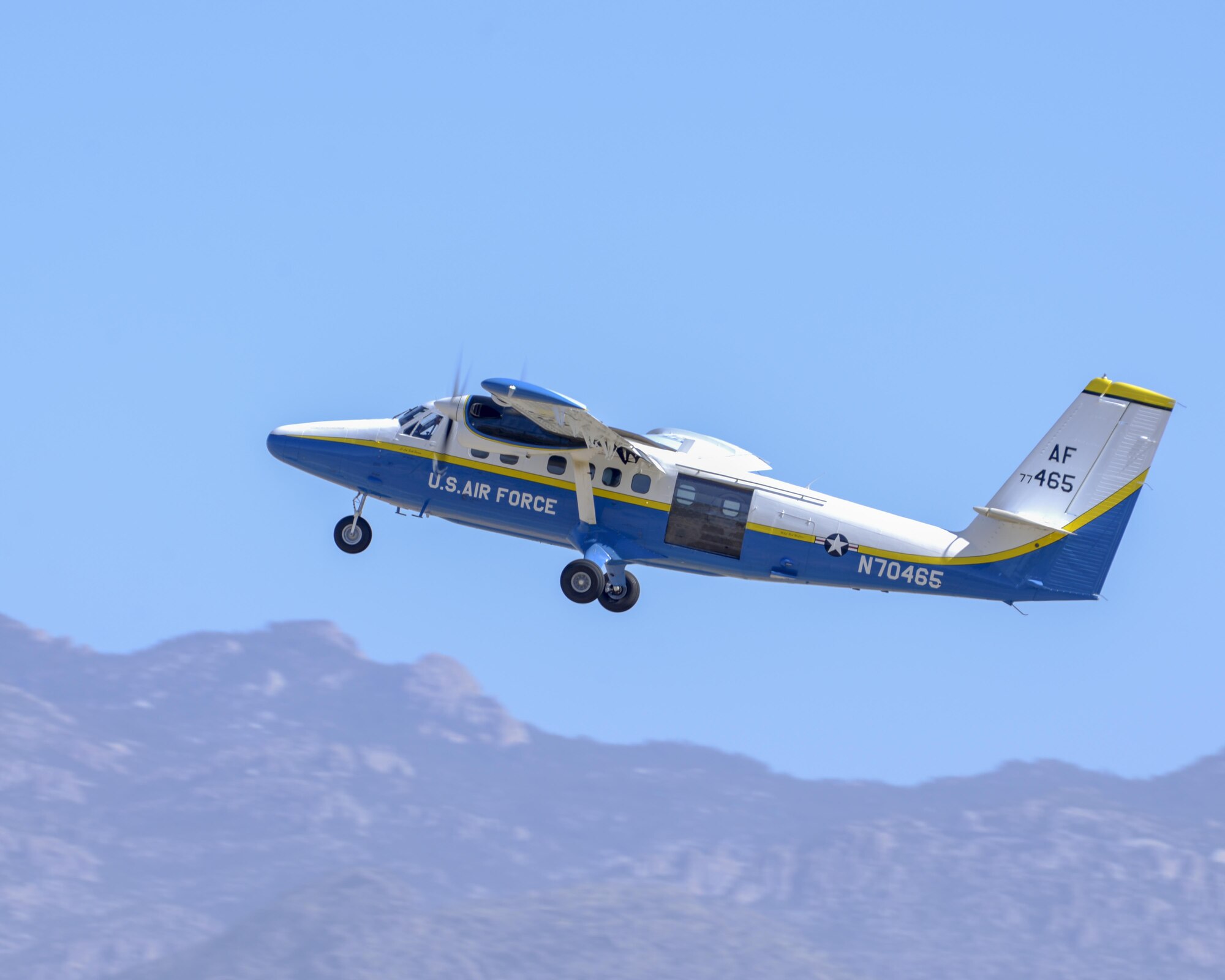 A U.S. Air Force UV-18B Twin Otter takes off while carrying the Wings of Blue skydiving demonstration team during the Thunder and Lightning over Arizona Open House at Davis-Monthan Air Force Base, Ariz., March 12, 2016. The demonstration team travels across the country to airshows, sporting events, and other venues to represent the Air Force in precision parachuting. (U.S. Air Force photo by Senior Airman Chris Massey/Released)