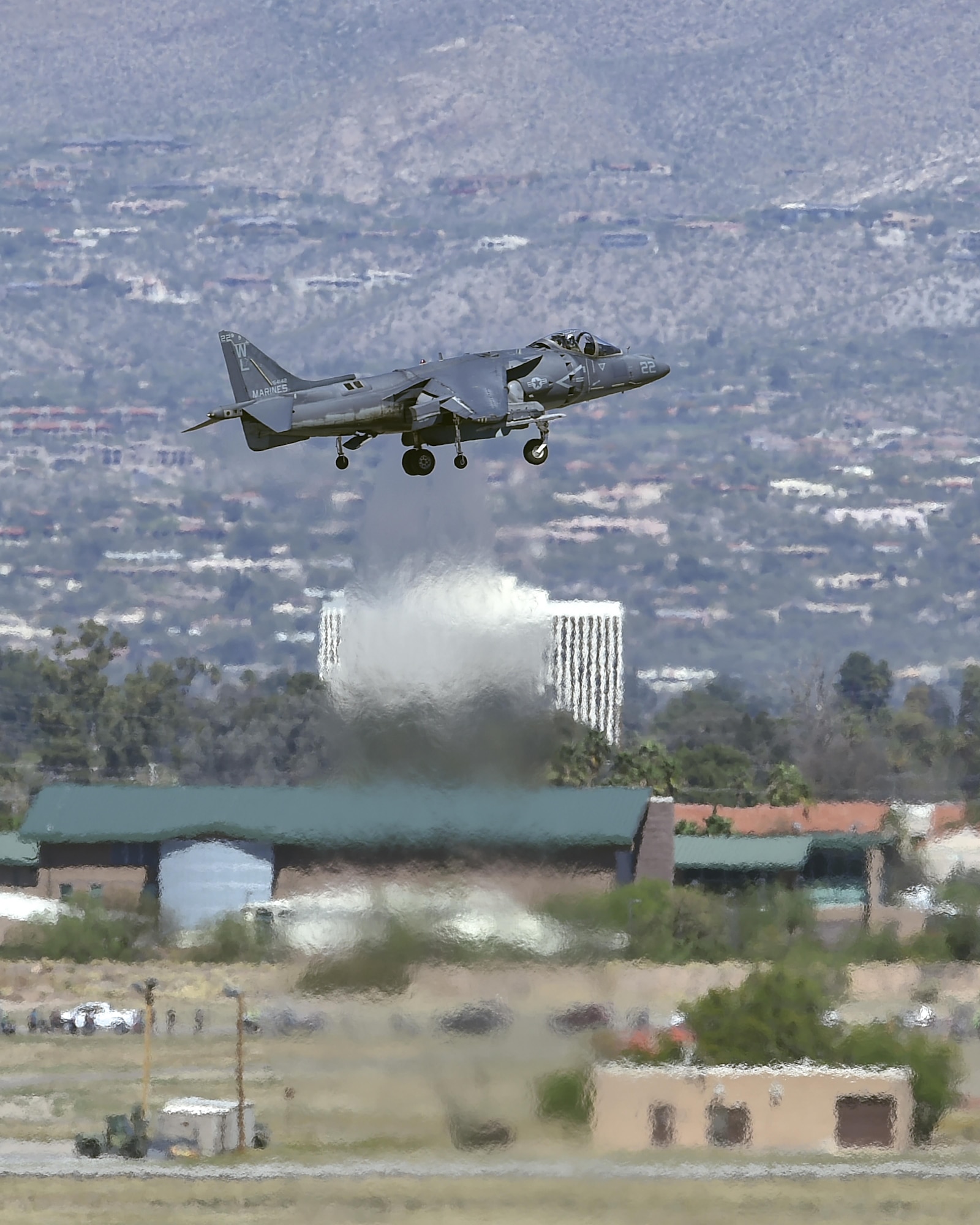 A U.S. Marine Corps AV-8 Harrier performs a demonstration during the Thunder and Lightning over Arizona Open House at Davis-Monthan Air Force Base, Ariz., March 12, 2016. The Harrier thrusts 22,000 pounds in order to hover like a helicopter and blast forward like a jet at near-supersonic speeds. (U.S. Air Force photo by Senior Airman Chris Massey/Released)