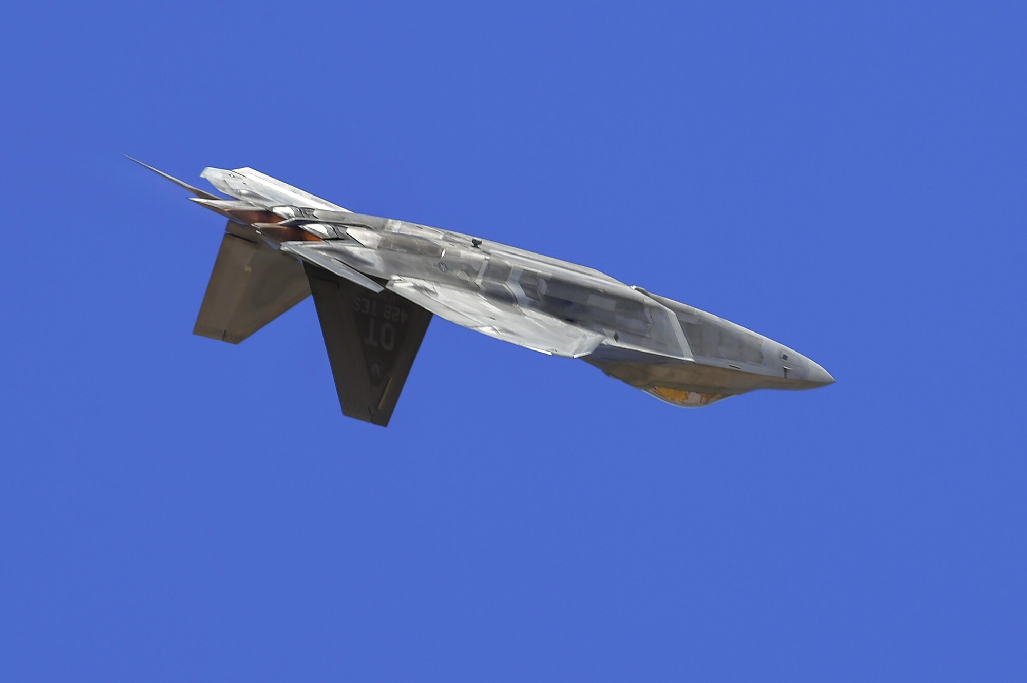 A U.S. Air Force F-22 Raptor performs an aerial demonstration during the Thunder and Lightning over Arizona Open House at Davis-Monthan Air Force Base, Ariz., March 12, 2016.  The base opened its doors for the free event to showcase military air power and express appreciation for the local community's continuous support of D-M's missions. (U.S. Air Force photo by Senior Airman Chris Massey/Released)