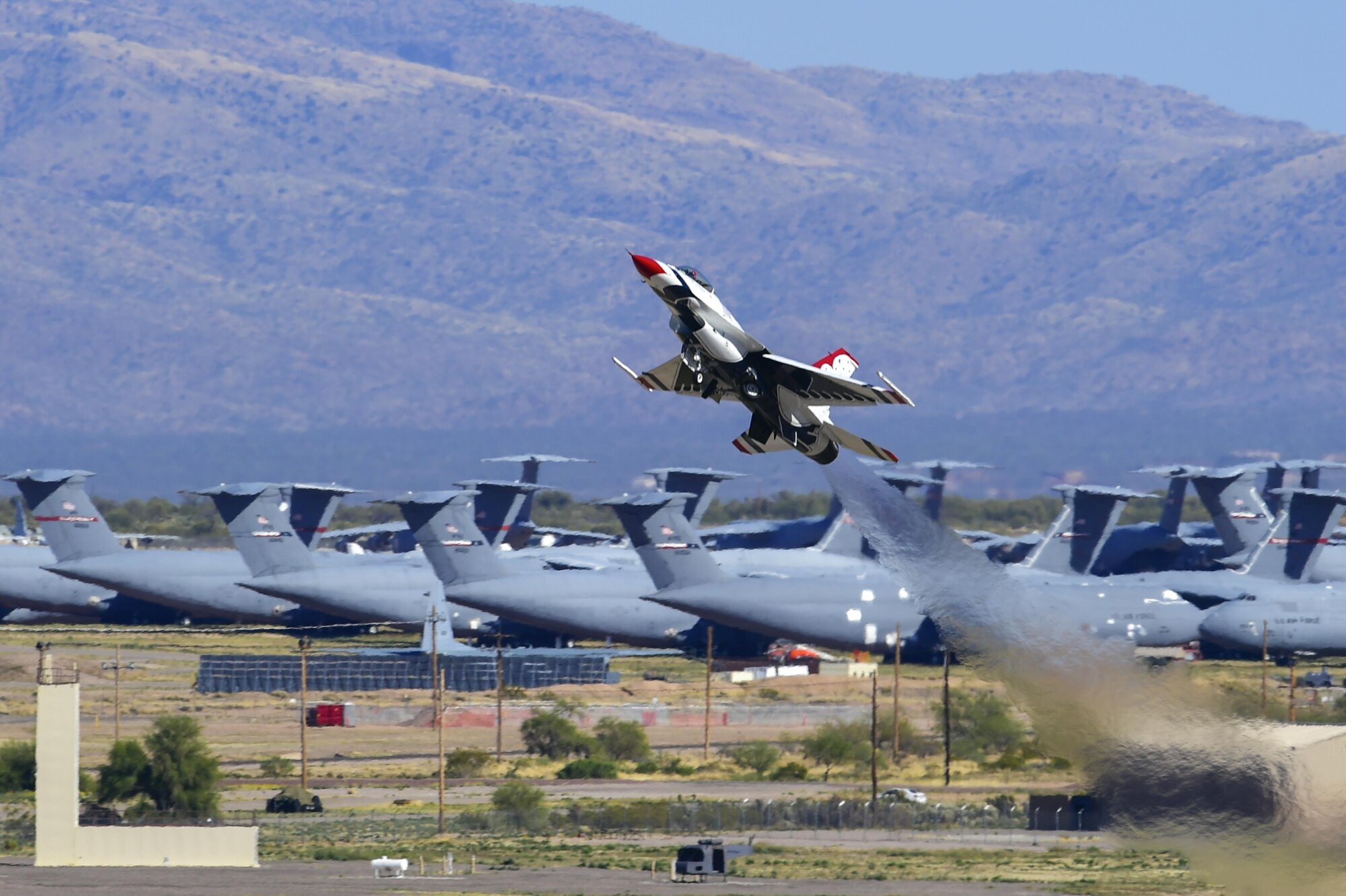 U.S. Air Force Maj Alex Turner, U.S. Air Force Air Demonstration Squadron opposing solo pilot, launches Thunderbird 6, an F-16 Fighting Falcon, during the Thunder and Lightning over Arizona Open House at Davis-Monthan Air Force Base, Ariz., March 12, 2016. The open house featured aerial demonstrations from various teams and numerous static displays allowing the public to gain a better understanding of the Air Force. (U.S. Air Force photo by Senior Airman Chris Massey/Released)