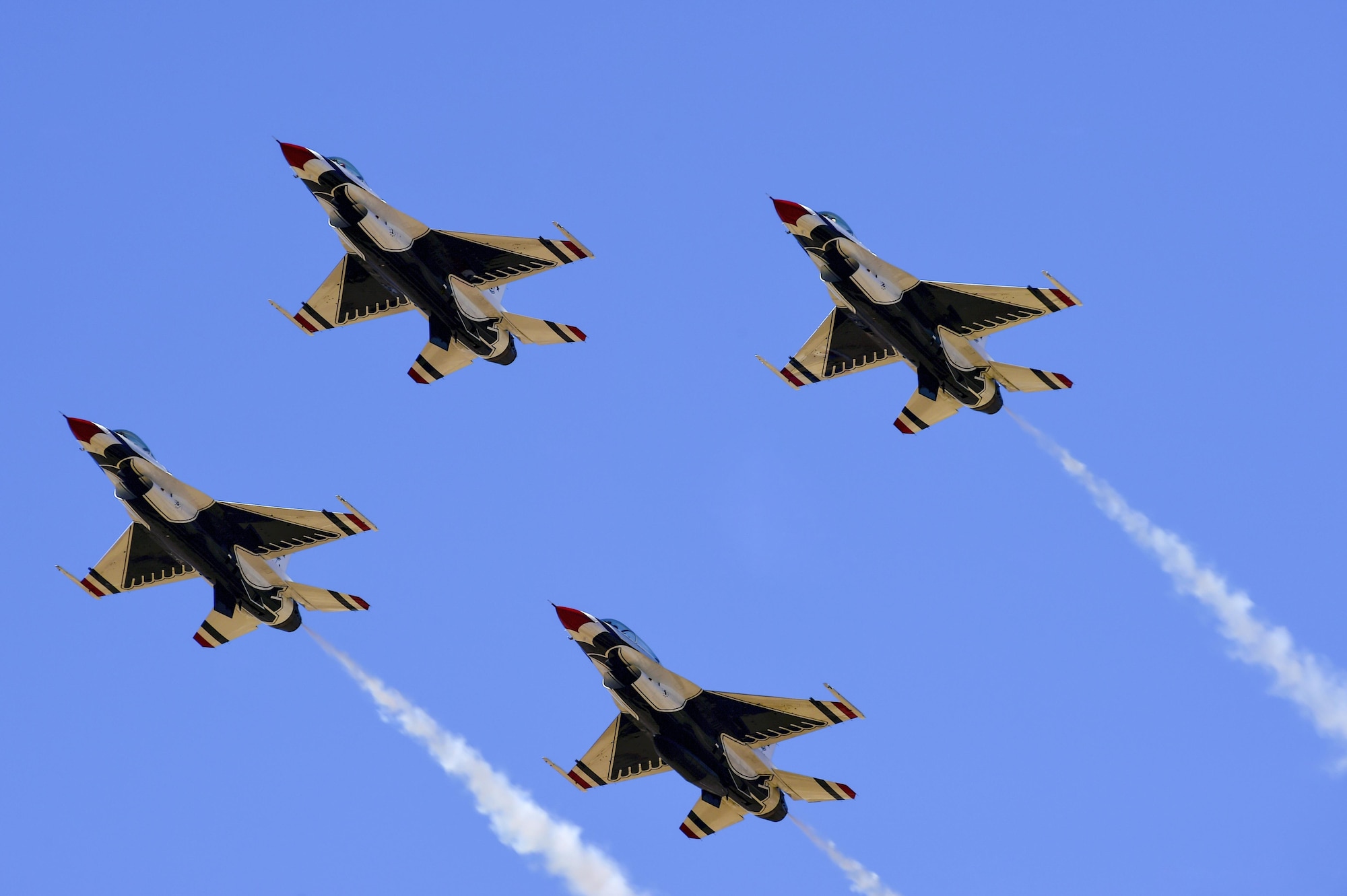 Four F-16 Fighting Falcon Thunderbirds, from the U.S. Air Force Air Demonstration Squadron, fly in a diamond formation during the Thunder and Lightning over Arizona Open House at Davis-Monthan Air Force Base, Ariz., March 12, 2016. The free event featured aerial demonstrations from various teams and numerous static displays. (U.S. Air Force photo by Senior Airman Chris Massey/Released)