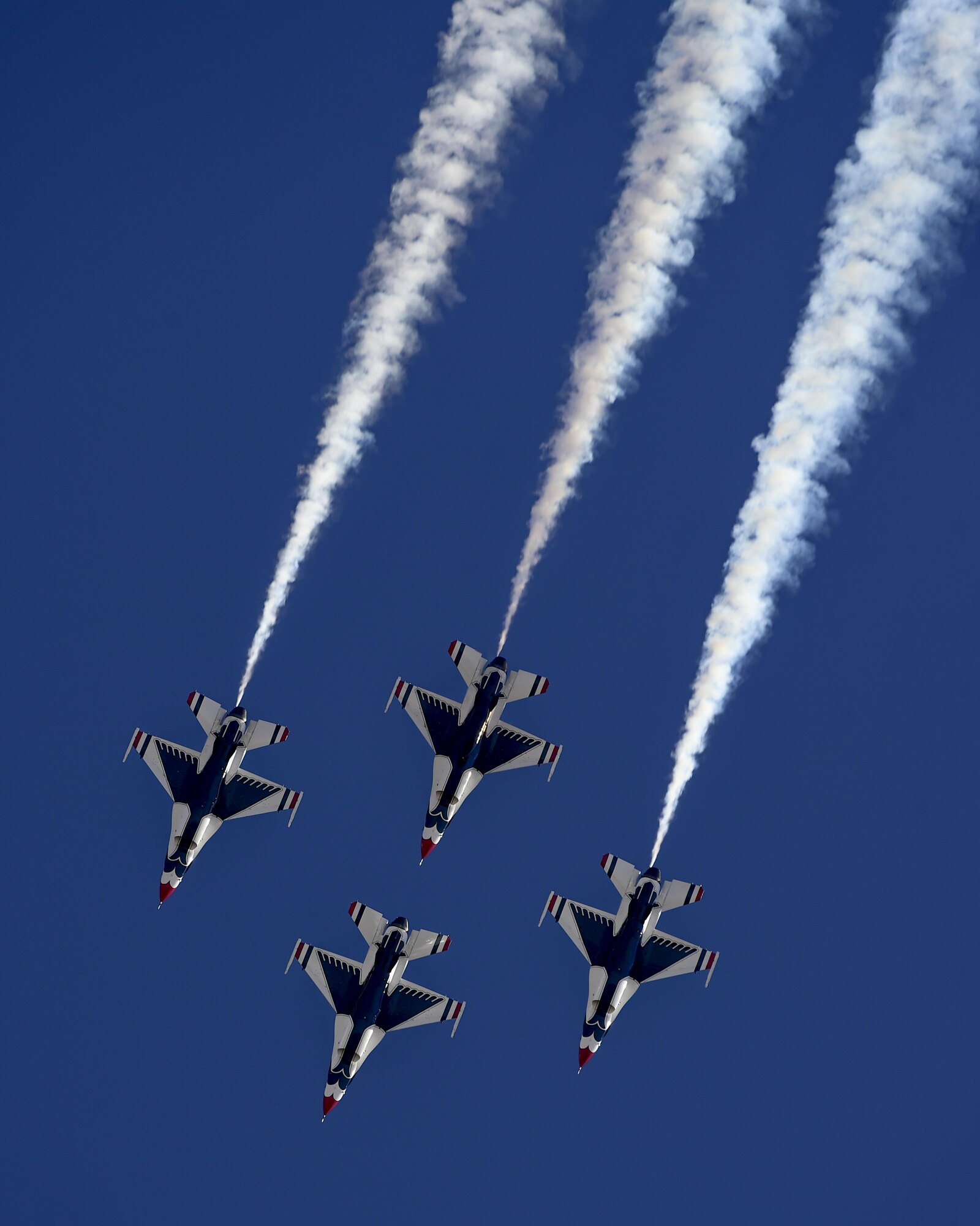 Four F-16 Fighting Falcon Thunderbirds, from the U.S. Air Force Air Demonstration Squadron, fly in a diamond formation during the Thunder and Lightning over Arizona Open House at Davis-Monthan Air Force Base, Ariz., March 12, 2016. The free event featured aerial demonstrations from various teams and numerous static displays. (U.S. Air Force photo by Senior Airman Chris Massey/Released)