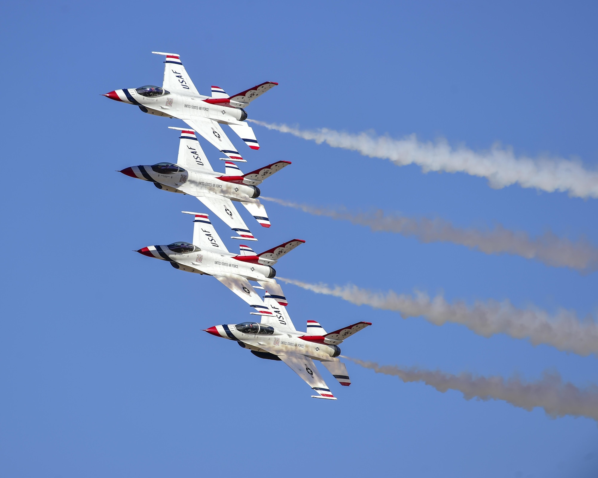 Four F-16 Fighting Falcon Thunderbirds, from the U.S. Air Force Air Demonstration Squadron, fly in formation during the Thunder and Lightning over Arizona Open House at Davis-Monthan Air Force Base, Ariz., March 12, 2016. The free event featured aerial demonstrations from various teams and numerous static displays. (U.S. Air Force photo by Senior Airman Chris Massey/Released)