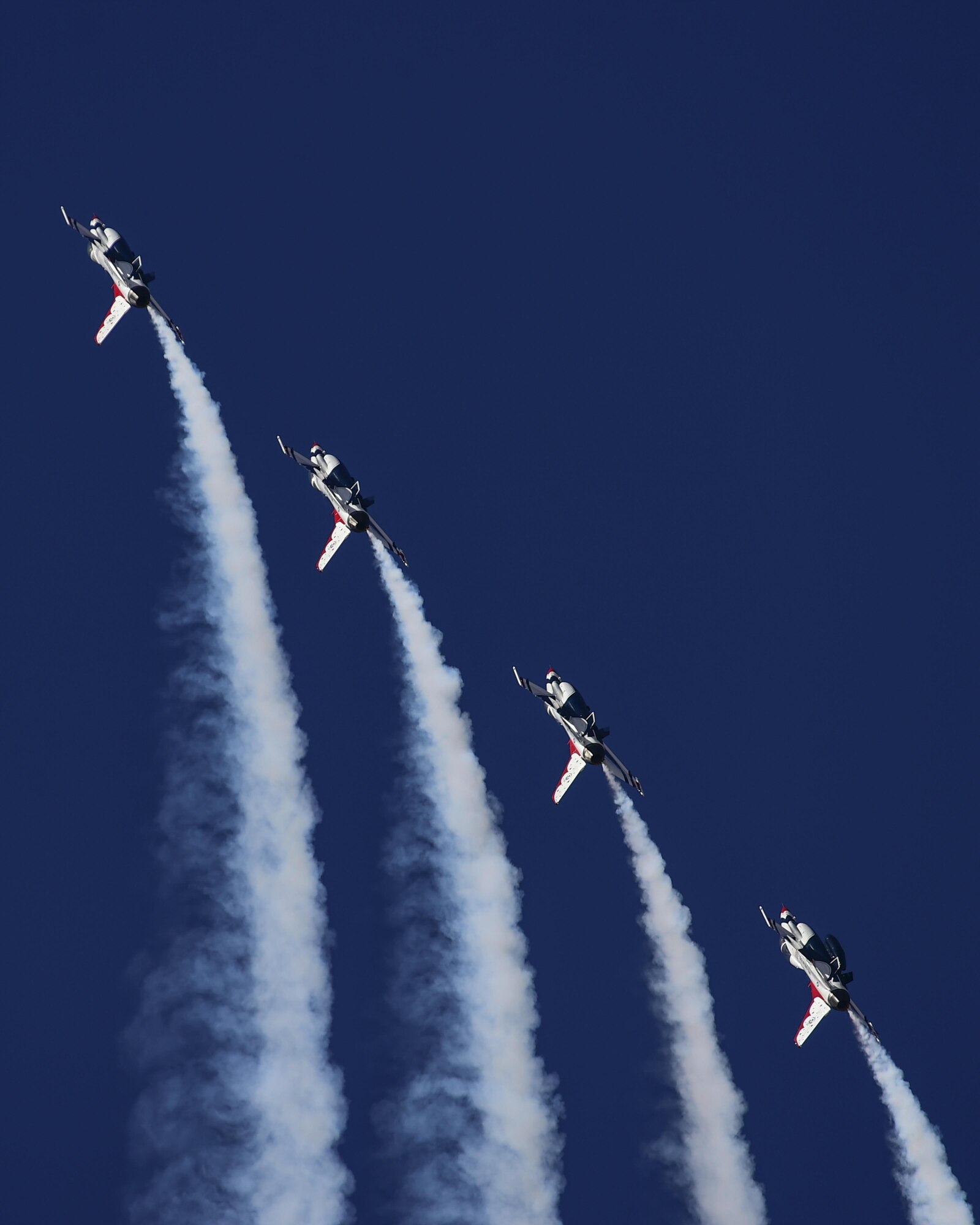 Four F-16 Fighting Falcon Thunderbirds, from the U.S. Air Force Air Demonstration Squadron, perform the “Delta Pitch-up” aerial maneuver during the Thunder and Lightning over Arizona Open House at Davis-Monthan Air Force Base, Ariz., March 12, 2016. The free event featured aerial demonstrations from various teams and numerous static displays. (U.S. Air Force photo by Senior Airman Chris Massey/Released)