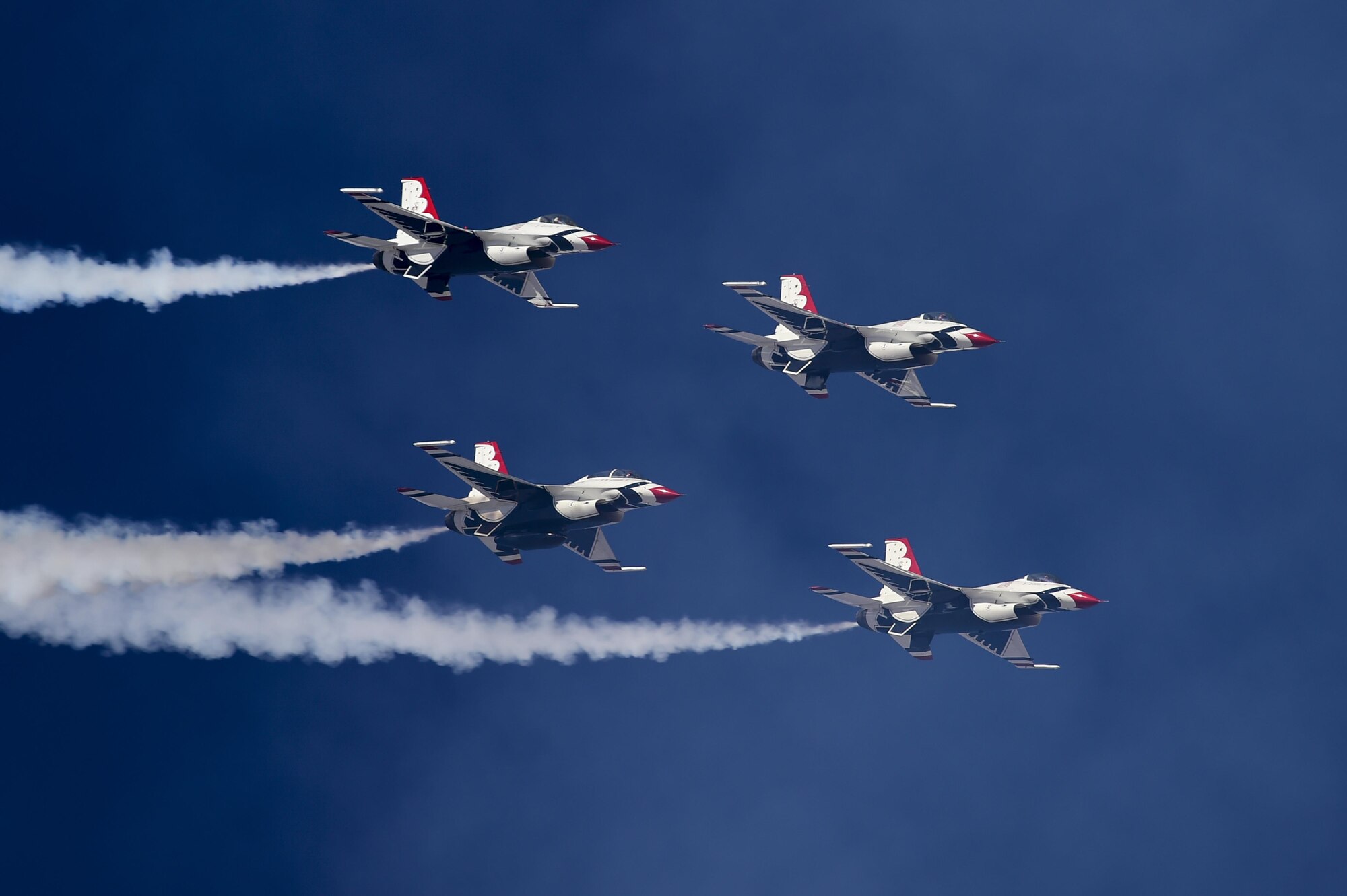 Four F-16 Fighting Falcon Thunderbirds, from the U.S. Air Force Air Demonstration Squadron, fly in a diamond formation during the Thunder and Lightning over Arizona Open House at Davis-Monthan Air Force Base, Ariz., March 12, 2016. The free event featured aerial demonstrations from various teams and numerous static displays. (U.S. Air Force photo by Senior Airman Chris Massey/Released)