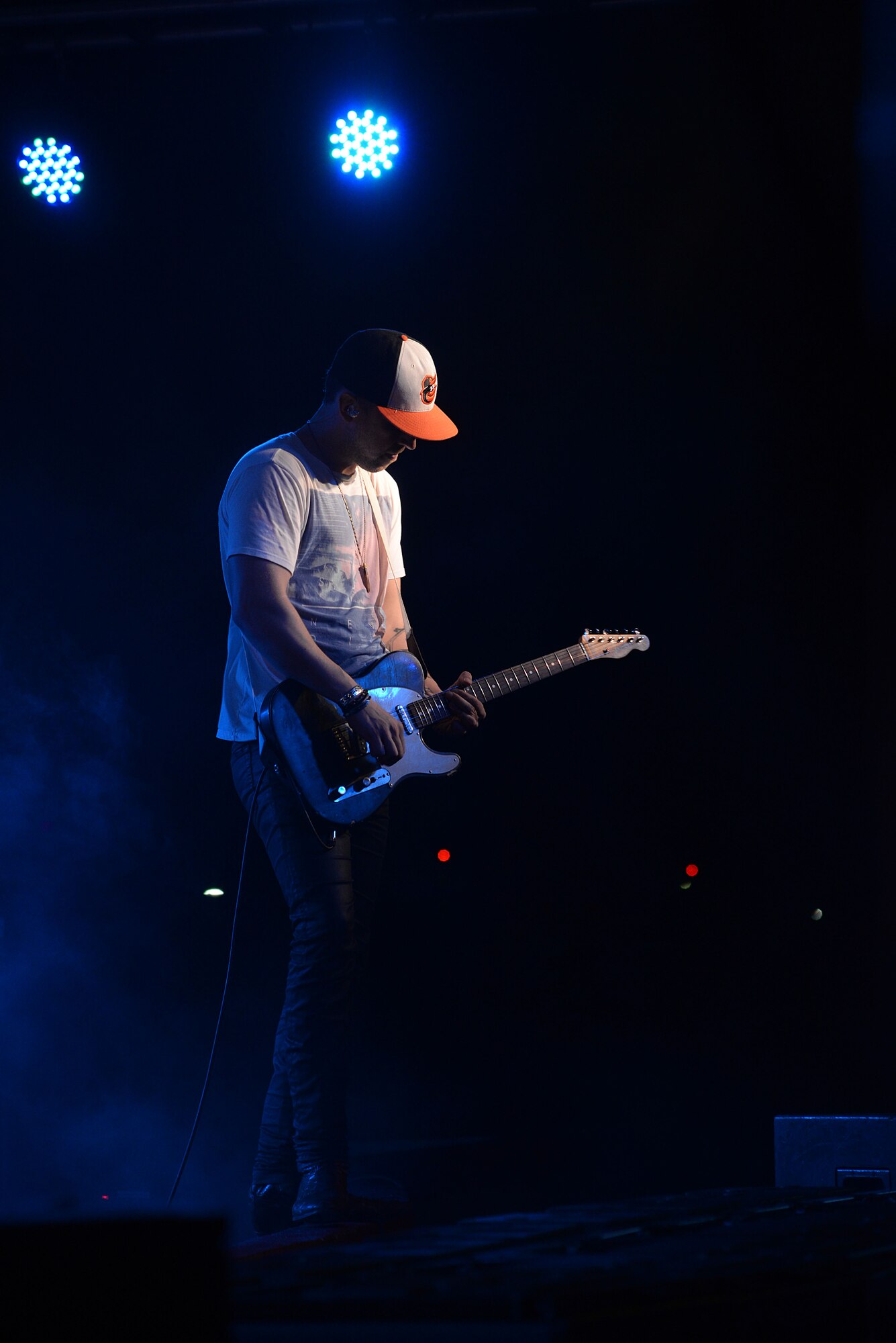 T.J. Osborne, Brothers Osborne lead vocalist, plays a guitar solo during a concert March 12, 2016, at Andersen Air Force Base, Guam. While on Guam, the band played two concerts on Andersen AFB and U.S. Naval Base Guam. (U.S. Air Force photo/ Airman 1st Class Jacob Skovo)