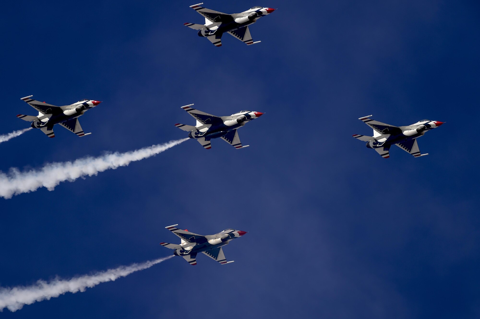 Five F-16 Fighting Falcon Thunderbirds, from the U.S. Air Force Air Demonstration Squadron, perform aerial maneuvers during the Thunder and Lightning over Arizona Open House at Davis-Monthan Air Force Base, Ariz., March 12, 2016. The free event featured aerial demonstrations from various teams and numerous static displays. (U.S. Air Force photo by Senior Airman Chris Massey/Released)