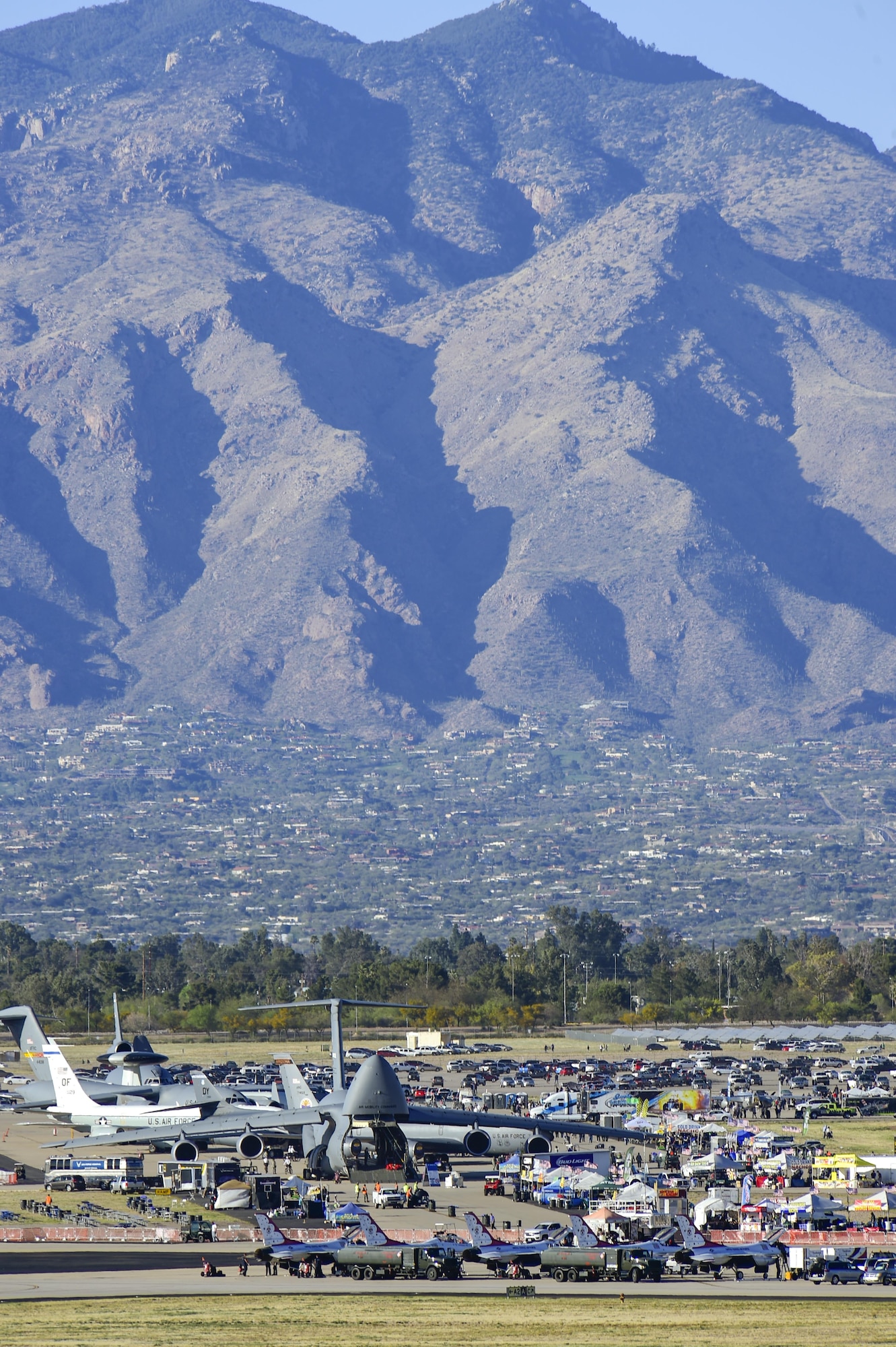 Attendees exit the flightline as the first day of the Thunder and Lightning over Arizona Open House comes to an end at Davis-Monthan Air Force Base, Ariz., March 12, 2016. The free event featured aerial demonstrations from various teams and numerous static displays. (U.S. Air Force photo by Senior Airman Chris Massey/Released)
