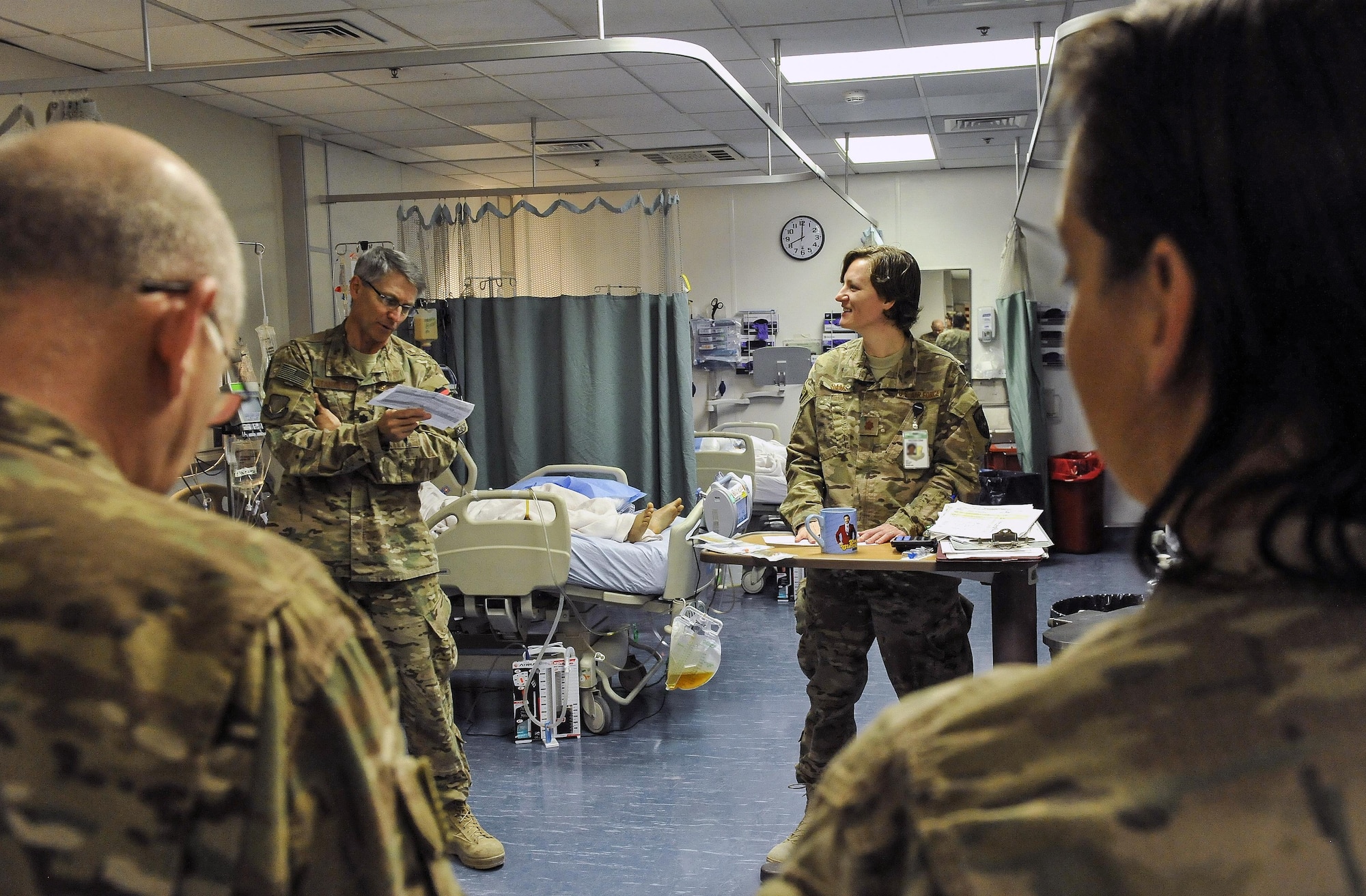 Maj. (Dr.) Valerie Sams, 455th Expeditionary Medical Group trauma czar, listens to a patient progress and treatments from Lt. Col. (Dr.) Robert Stankewitz, 455th EMDG staff physician, at Craig Joint-Theater Hospital on Bagram Air Field, Afghanistan, March 5, 2016. The trauma czar is responsible for coordinating patient care and making the final decision on treatment. (U.S. Air Force photo by Tech. Sgt. Nicholas Rau)