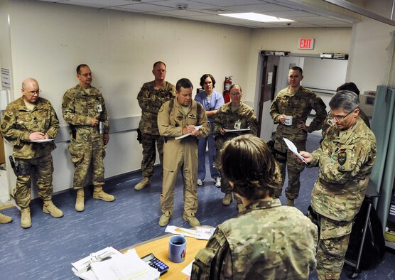 Maj. (Dr.) Valerie Sams, 455th Expeditionary Medical Group trauma czar, listens to the opinions of medical specialists and doctors before deciding on treatment at Craig Joint Theater Hospital on Bagram Airfield, Afghanistan, March 5, 2016. The trauma czar is responsible for coordinating patient care and making the final decision on treatment. (U.S. Air Force photo/Tech. Sgt. Nicholas Rau)