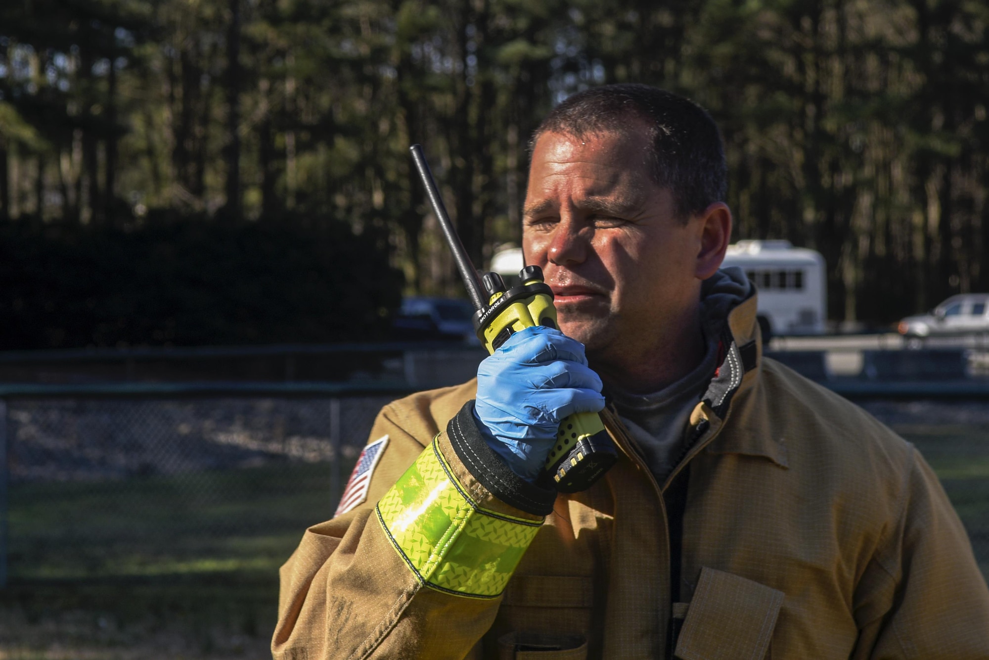 Andrew Eichelberger, 4th Civil Engineer Squadron fire fighter, coordinates with other agencies during a mass casualty exercise, March 9, 2016, at Seymour Johnson Air Force Base, North Carolina. The exercise involved members of Team Seymour, Wayne Memorial Hospital and Wayne County emergency medical services personnel to test their collaboration in the event of a real world incident. (U.S. Air Force photo/Airman Shawna L. Keyes)