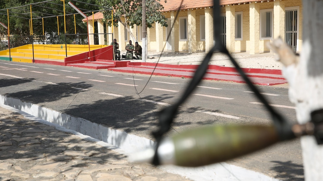 Senegalese soldiers learn how to use a pulley system and rope to remove an inert mortar round from the ground and move it safely to another spot in Bargny, Senegal March 8, 2016. The intent wasn’t to actually move the ordnance, rather to get the students familiar with different types of tools. Since Feb. 15, a group of explosive ordnance disposal technicians with Special-Purpose Marine Air-Ground Task Force Crisis Response-Africa, began assisting Senegalese engineers as part of the Humanitarian Mine Action Program through what is called a train-the-trainer course. 