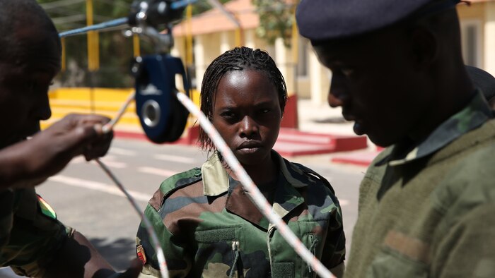 Senegalese soldiers learn how to use a pulley system and rope to remove an inert mortar round from the ground and move it safely to another spot in Bargny, Senegal March 8, 2016. The intent wasn’t to actually move the ordnance, rather to get the students familiar with different types of tools. Since Feb. 15, a group of explosive ordnance disposal technicians with Special-Purpose Marine Air-Ground Task Force Crisis Response-Africa, began assisting Senegalese engineers as part of the Humanitarian Mine Action Program through what is called a train-the-trainer course. 