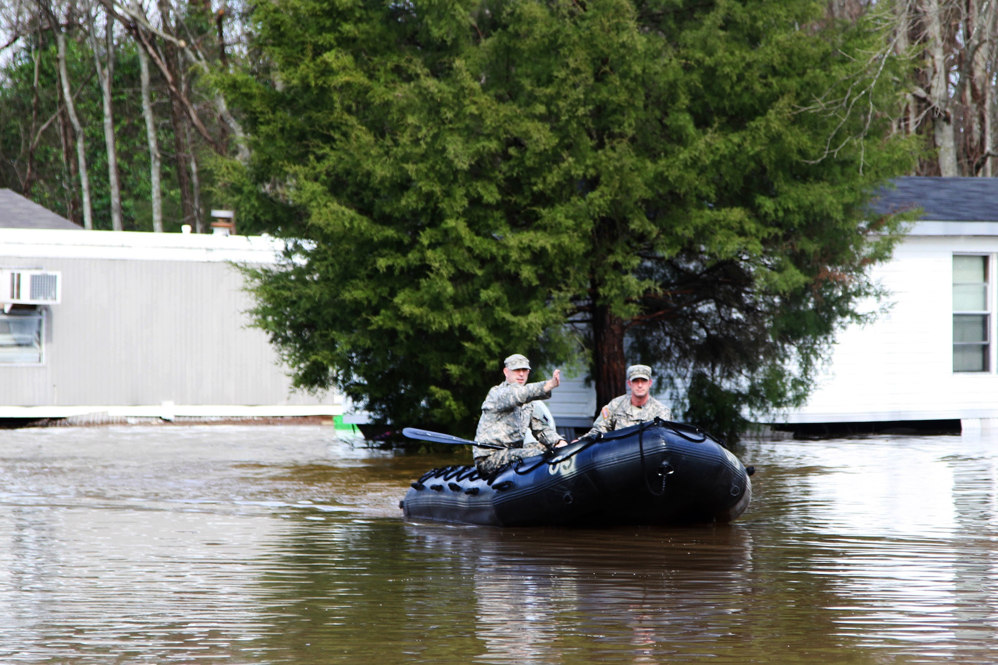 Louisiana Army National Guardsmen 2nd Lt. William Hall and Cpl. Kurt Humpreys, of the 2nd Squadron, 108th Cavalry Regiment, conduct door-to-door searches in Pecan Estates in Bossier City, La., March 10, 2016. (U.S. Army National Guard photo/Staff Sgt. Jerry W. Rushing)