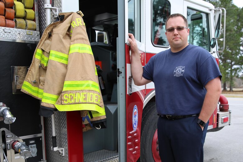 Dustin J. Schneider, a firefighter at Marine Corps Air Station Cherry Point, N.C., earned the Marine Corps Civilian Firefighter of the Year Award for excellence in his job performance. Schneider was chosen from firefighters in fire departments across Marine Corps. Schneider serves with Cherry Point Fire and Emergency Services. (U.S. Marine Corps photo by Lance Cpl. Mackenzie Gibson/Released)