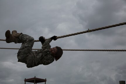 U.S. Army Sgt. Marcy DiOssi assigned to the 102nd Training Division of Ft. Leonard Wood, Mo., navigates the Inverted Rope Decent obstacle at the Obstacle Course event during the 80th Training Command 2016 Best Warrior Competition (BWC) in conjunction with the 99th Regional Support Command at Camp Bullis, Texas, March 11, 2016. The BWC is an annual competition to identify the strongest and most well-rounded Soldiers through the accomplishment of physical and mental challenges, as well as basic Soldier skills. (U.S. Army photo by Cpl. Cope Steven).