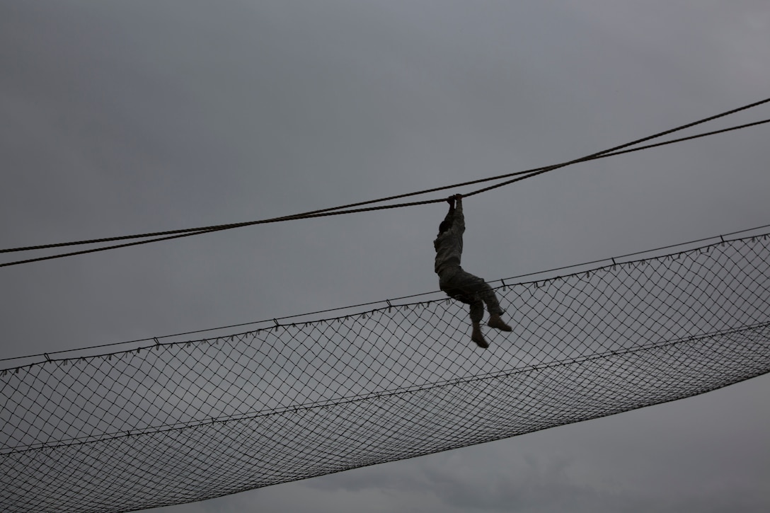 U.S. Army Sgt. Agnes Jibke assigned to the 7-80th TCBN of Ft. Eustis Va, struggles to hang on at the Inverted Rope Decent obstacle at the Obstacle Course event during the 80th Training Command 2016 Best Warrior Competition (BWC) in conjunction with eh 99th Regional Suport Command at Camp Bullis, Texas, March 11, 2016. The BWC is an annual competition to identify the strongest and most well-rounded Soldiers through the accomplishment of physical and mental challenges, as well as basic Soldier skills. (U.S. Army photo by Cpl. Cope Steven).