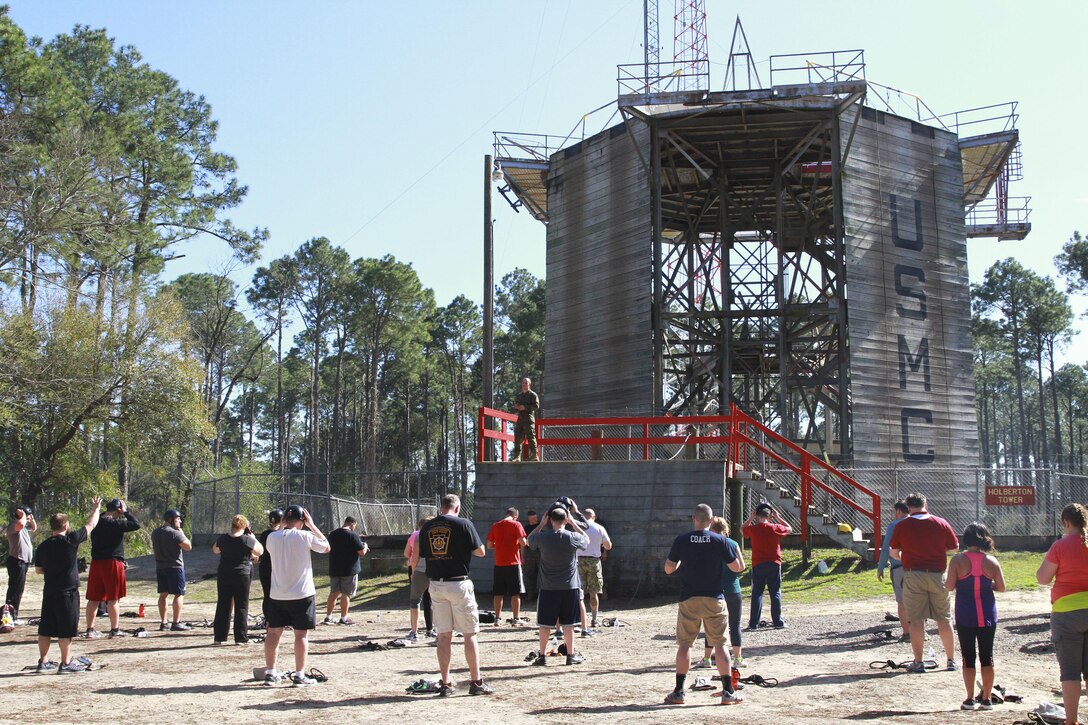 Educators with Recruiting Station Harrisburg prepare to descend on the repel tower during the Educators’ Workshop, at Recruit Training Depot Parris Island, March 10, 2016. The repel tower is one of many challenges recruits must overcome before earning the title of Marine.