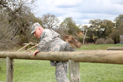 U.S. Army Command Sgt. Maj. Steve Norris, assigned to 3/379th Logistic Support Battalion, demonstrate the Vaults Course during the 80th Training Command 2016 Best Warrior Competition (BWC) in conjunction with 99th Regional Support Command at Camp Bullis, Texas, March 11, 2016. The BWC is an annual competition to identify the strongest and most well-rounded Soldiers through the accomplishment of physical and mental challenges, as well as basic Soldier skills. (U.S. Army photo by Spc. Darnell Torres/Released).