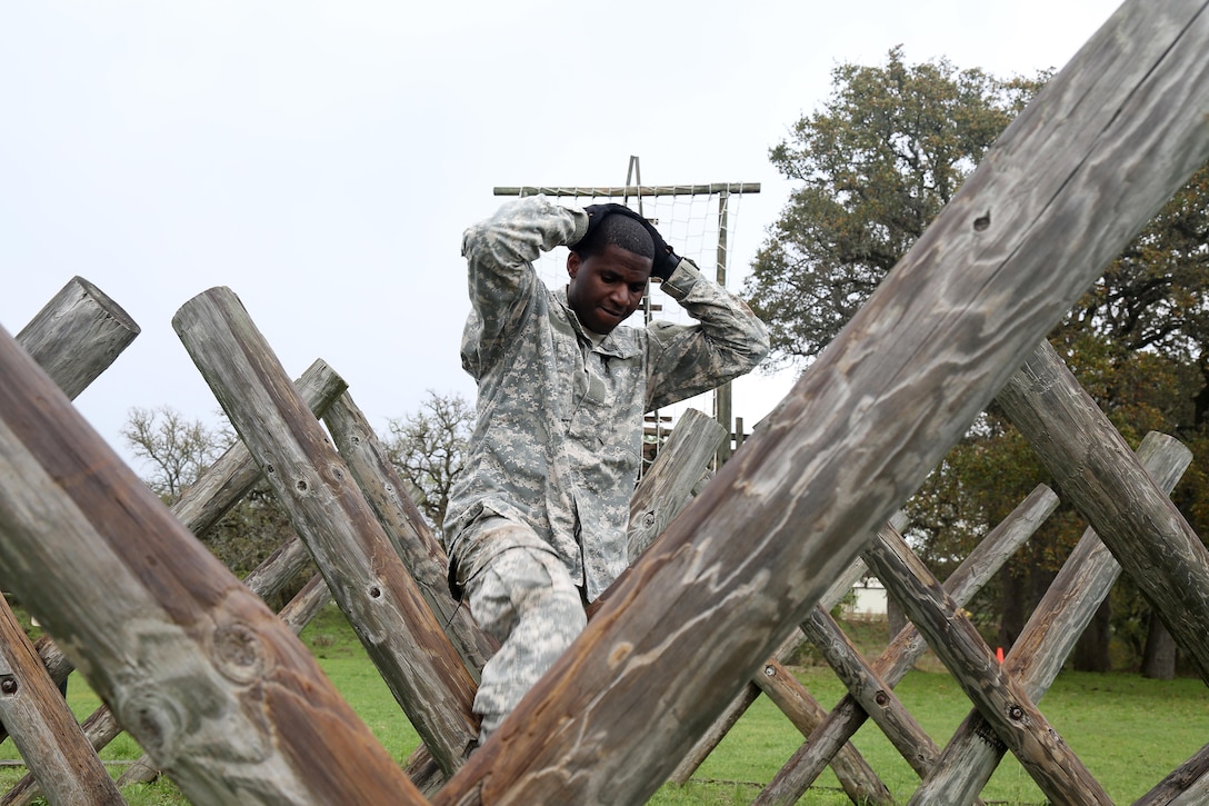U.S. Army Staff Sgt. Bwalya Mbulo, assigned to 7th Battalion 104th Transportation Company Bell, Calif., navigates the Tough Nut Course during the 80th Training Command 2016 Best Warrior Competition (BWC) in conjunction with 99th Regional Support Command at Camp Bullis, Texas, March 11, 2016. The BWC is an annual competition to identify the strongest and most well-rounded Soldiers through the accomplishment of physical and mental challenges, as well as basic Soldier skills. (U.S. Army photo by Spc. Darnell Torres/Released).