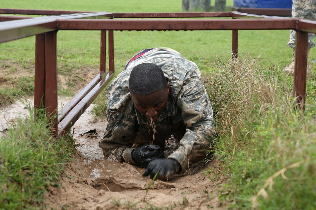 U.S. Army Staff Sgt. Bwalya Mbulo, assigned to 7th Battalion 104th Transportation Company Bell, Calif., navigates the Law Crawl Pits Course during the 80th Training Command 2016 Best Warrior Competition (BWC) in conjunction with 99th Regional Support Command at Camp Bullis, Texas, March 11, 2016. The BWC is an annual competition to identify the strongest and most well-rounded Soldiers through the accomplishment of physical and mental challenges, as well as basic Soldier skills. (U.S. Army photo by Spc. Darnell Torres/Released).