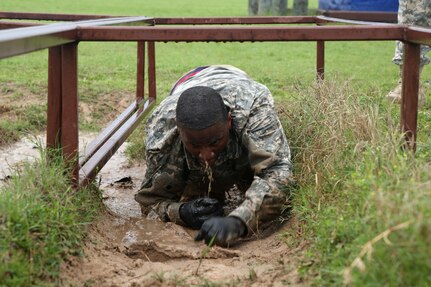 U.S. Army Staff Sgt. Bwalya Mbulo, assigned to 7th Battalion 104th Transportation Company Bell, Calif., navigates the Law Crawl Pits Course during the 80th Training Command 2016 Best Warrior Competition (BWC) in conjunction with 99th Regional Support Command at Camp Bullis, Texas, March 11, 2016. The BWC is an annual competition to identify the strongest and most well-rounded Soldiers through the accomplishment of physical and mental challenges, as well as basic Soldier skills. (U.S. Army photo by Spc. Darnell Torres/Released).