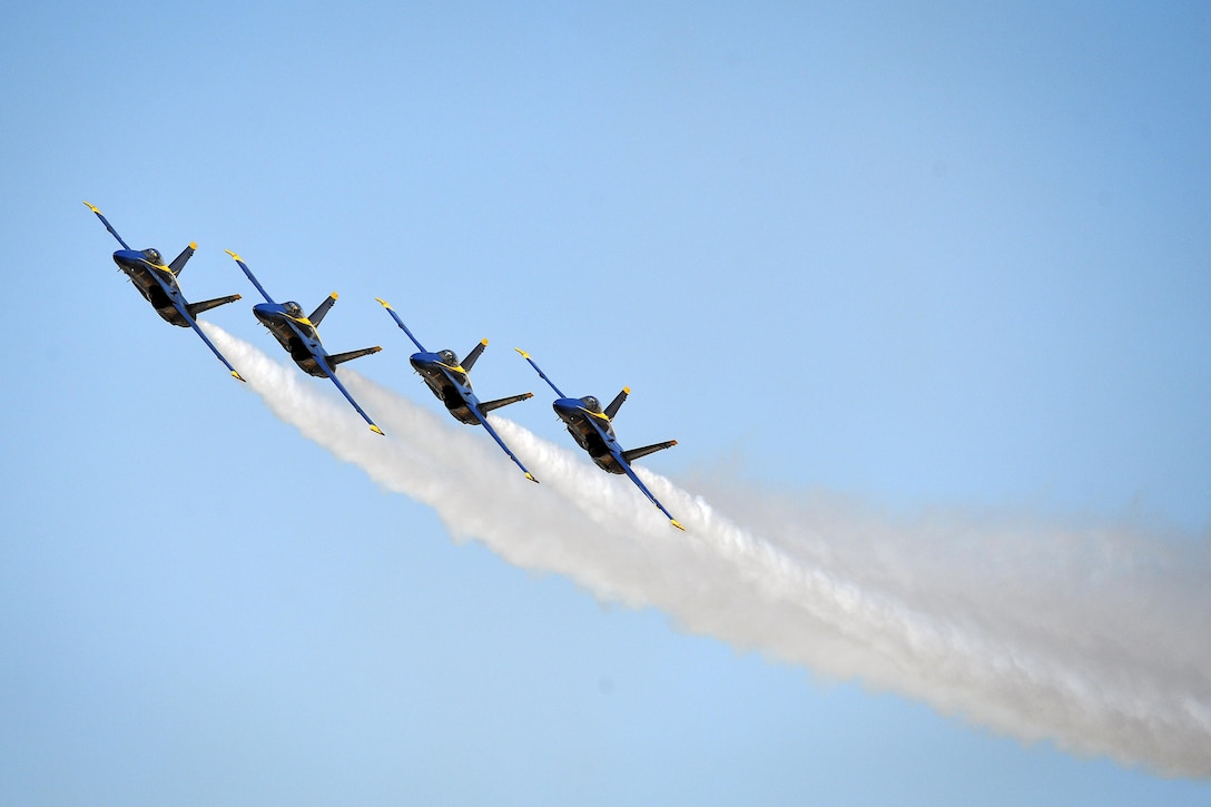 The Blue Angels, the Navy's flight demonstration squadron, perform a parade maneuver during the Naval Air Facility El Centro Airshow in El Centro, Calif., March 12, 2016. The squadron, celebrating its 70th anniversary, is scheduled to perform 65 demonstrations at 34 locations across the country in 2016. Navy photo by Petty Officer 2nd Class Daniel M. Young