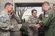 Senior Airman Faith Glas is surprised to receive her Below the Zone stripes at the weather center at Vance Air Force Base, Oklahoma, March 7. BTZ is a merit-based program where airmen 1st class are nominated to sew on the rank senior airman six months early. (U.S. Air Force photo by Staff Sgt. Nancy Falcon)