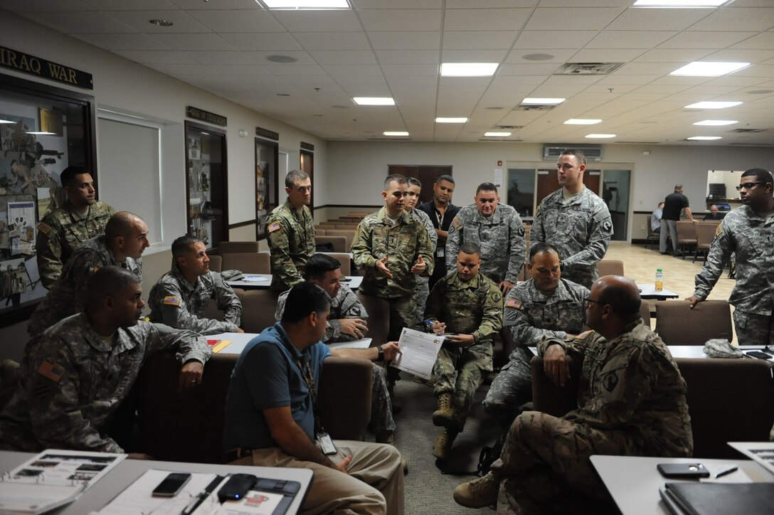 Participants work through a practical exercise on Immediate Response Authority during a DSCA 101 brief held at the 1st Mission Support Command (MSC) Headquarters, on Fort Buchanan, Puerto Rico, March 10.