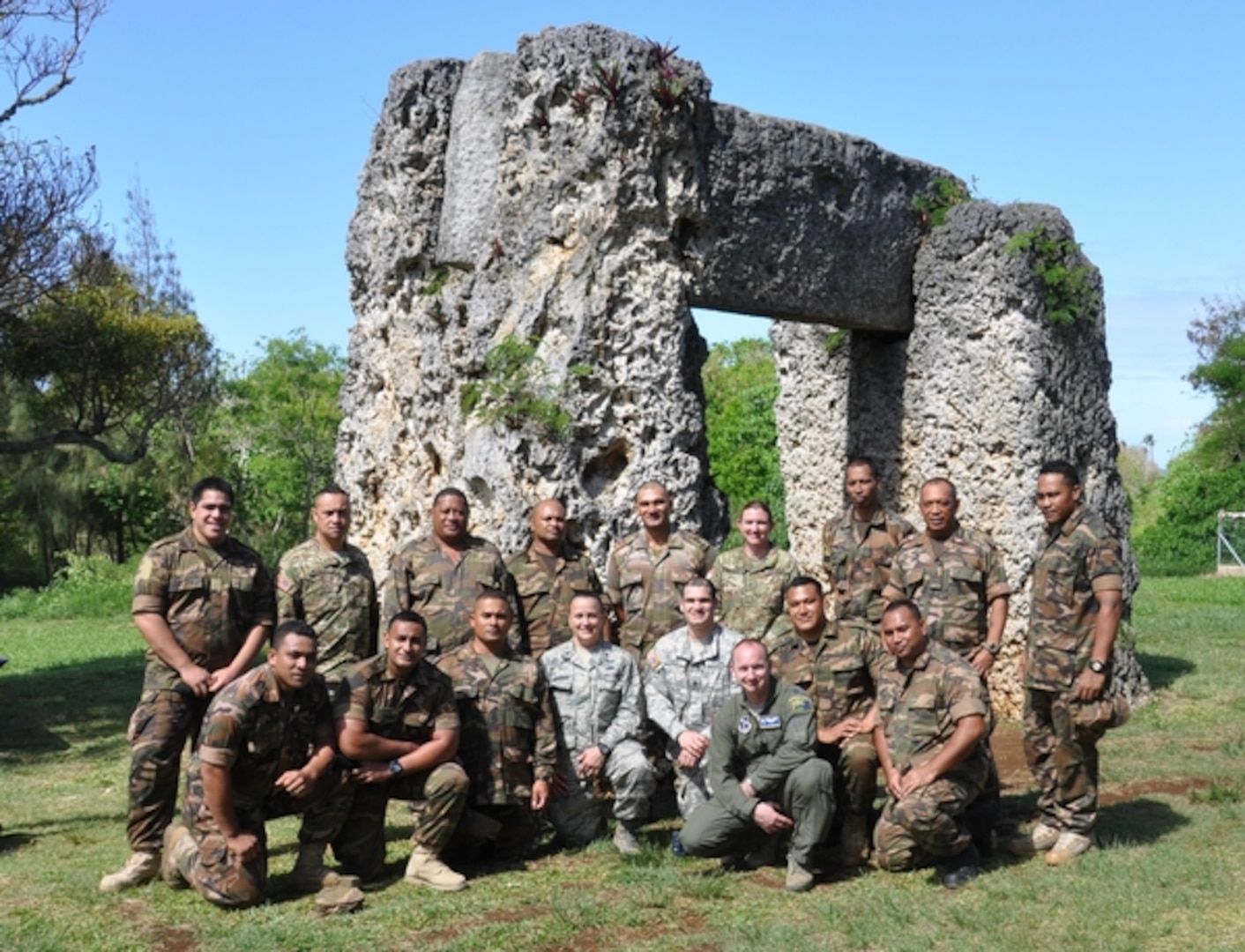 Members of the Nevada National Guard and His Majesty's Armed Forces pose in front of Ha'amonga 'a Maui, a historical monument built in Tonga about 1200.  The forces met for a weeklong communications knowledge exchange. 