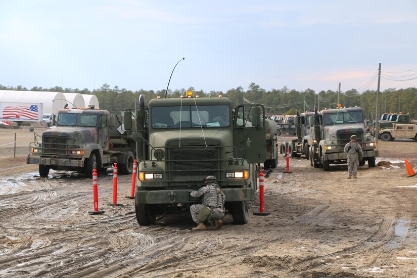 Soldiers of the Army Reserve’s 766th Transportation Battalion perform post convoy checks and maintenance during unit convoy operations, during WAREX 78-06-01 at Joint Base McGuire-Dix-Lakehurst, N.J., Feb. 1, 2015. The 84th Training Command’s first WAREX of the year was hosted by the 78th Training Division at Joint Base McGuire-Dix-Lakehurst, N.J., and Fort Hunter Liggett, Calif.; the exercise involved more than 40 units from across the U.S. Army Reserve, U.S. Army National Guard and Canadian Armed Forces.