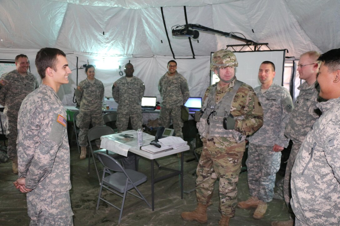 Soldiers of the Army Reserve’s 766th Transportation Battalion speak with Brig. Gen. Vincent B. Barker, 310th Sustainment Command (Expeditionary) commander, on exercise operational and living conditions during a staff assisted site visit during WAREX 78-06-01 at Joint Base McGuire-Dix-Lakehurst, N.J., Jan. 31, 2015. The 84th Training Command’s first WAREX of the year is hosted by the 78th Training Division at Joint Base McGuire-Dix-Lakehurst, N.J. and Fort Hunter Liggett, Calif.; the exercise involves more than 40 units from across the U.S. Army Reserve, U.S. Army National Guard and Canadian Armed Forces.