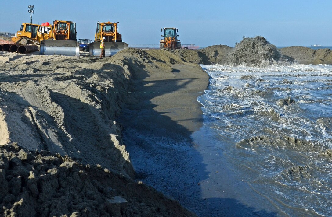 Despite weeks of inclement weather that has hampered dredging operations, contractor Marinex was busy pumping sand early Sunday evening on March 13th. The two-part project that is also happening at Carolina Beach is expected to be completed by April 30th. (USACE photo by Hank Heusinkveld) 