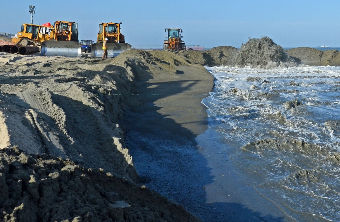 Despite weeks of inclement weather that has hampered dredging operations, contractor Marinex was busy pumping sand early Sunday evening on March 13th. The two-part project that is also happening at Carolina Beach is expected to be completed by April 30th. (USACE photo by Hank Heusinkveld) 