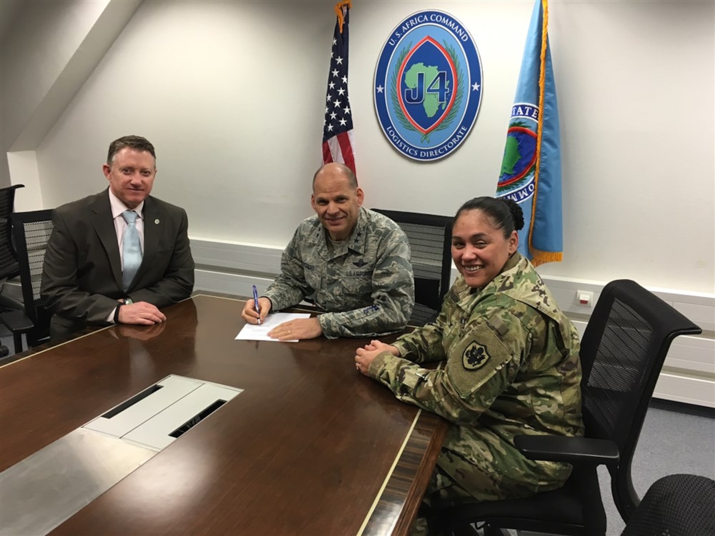 From left: Donald Liles, DLA liaison to U.S. Africa Command; Air Force Maj. Gen. James C. Vechery, AFRICOM director for logistics; and Army Col. Elizabeth Delbridge-Keough, commander of DLA Europe and Africa sign a three-year agreement to extend DLA support to AFRICOM in Stuttgart, Germany, Feb. 18, 2016. 
