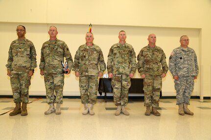 U.S. Army Maj. Gen. A.C. Roper(left), commander 80th Training Command stand in position of attention in front of the competitors during the 80th Training Command 2016 Best Warrior Competition (BWC) in conjunction with 99th Regional Support Command at Camp Bullis, Texas, March 11, 2016. The BWC is an annual competition to identify the strongest and most well-rounded Soldiers through the accomplishment of physical and mental challenges, as well as basic Soldier skills. (U.S. Army photo by Spc. Darnell Torres/Released).
