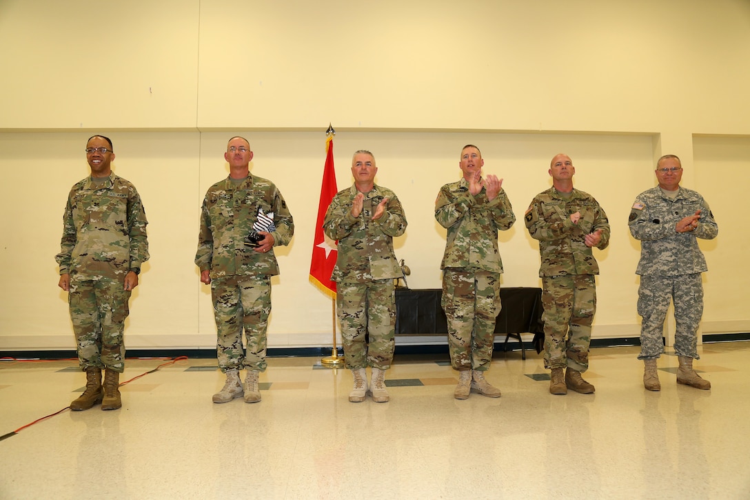 U.S. Army Maj. Gen. A.C. Roper(left), commander 80th Training Command stand in front of the competitors during the 80th Training Command 2016 Best Warrior Competition (BWC) in conjunction with 99th Regional Support Command at Camp Bullis, Texas, March 11, 2016. The BWC is an annual competition to identify the strongest and most well-rounded Soldiers through the accomplishment of physical and mental challenges, as well as basic Soldier skills. (U.S. Army photo by Spc. Darnell Torres/Released).