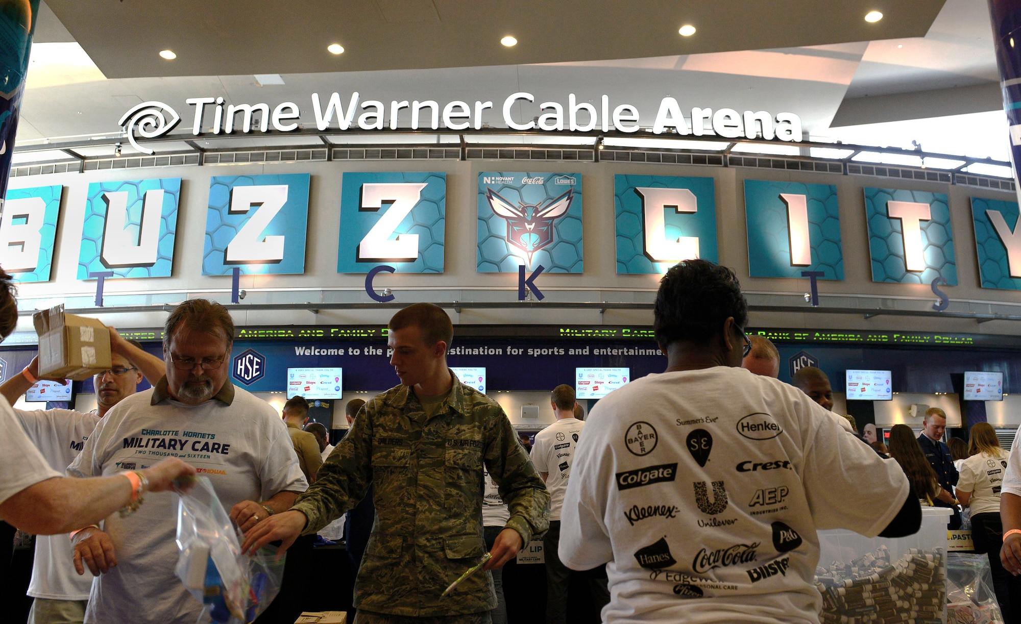U.S. Air Force Airman 1st Class Zachary Childers, 20th Force Support Squadron relocations technician, packs a deployment kit during a military care event at Time Warner Cable Arena, Charlotte. N.C., March 8, 2016. Throughout the event service members and civilian volunteers worked together to pack kits with essential item for deployed service members. (U.S. Air Force photo by Airman 1st Class Christopher Maldonado)