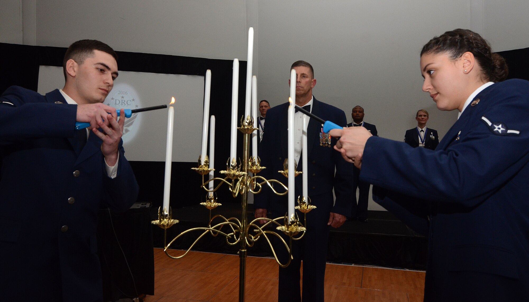 New chiefs are recognized for achieving the highest enlisted grade in the United States Air Force March 5, 2016. The lighting of the nine candles and the acceptance of the charges by our new chief master sergeants are symbolic to the chiefs’ group.   (U.S. Air Force photo by Don Peek)