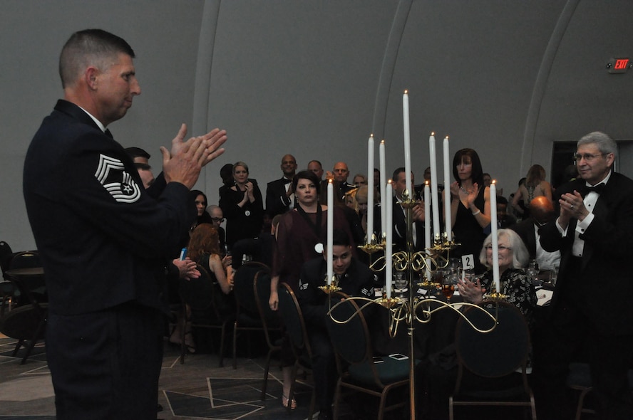 The lighting of the nine candles and the acceptance of the charges by our new chief master sergeants are symbolic to the chiefs’ group.  The new chiefs are recognized for their selection of promotion to the highest enlisted grade in the United States Air Force. (U.S. Air Force photo by Senior Airman Lauren Douglas )