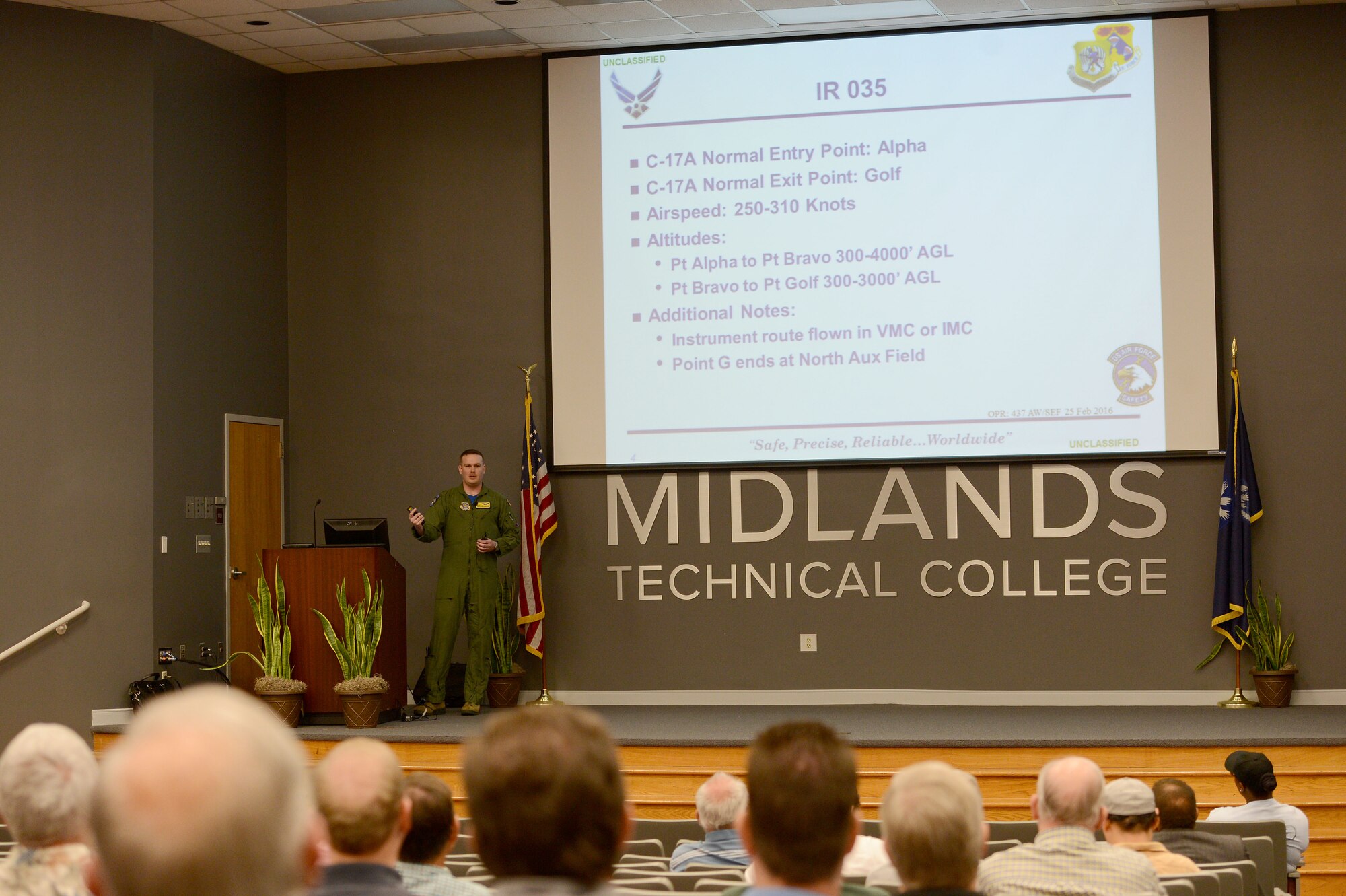 U.S. Air Force Capt. Jack Talkington, 15th Airlift Squadron wing safety officer, briefs locations and altitudes military aircraft are likely to be encountered in the local area at the annual general membership meeting of the South Carolina Aviation Safety Council at Midlands Technical College, Columbia, S.C., March 11, 2016. The SCASC invited armed forces personnel from Shaw Air Force Base and Joint Base Charleston to brief attendees on their respective missions and offer advice for avoiding midair collisions. (U.S. Air Force photo by Senior Airman Zade Vadnais)