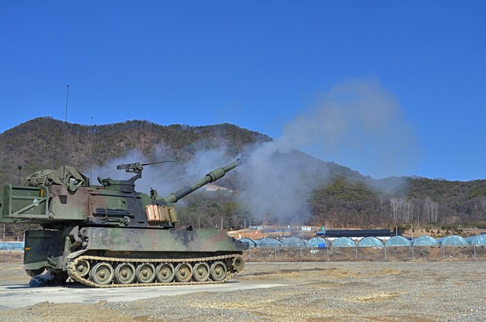 An artillery crew in a M109A6 Paladins fires rounds at Rodríguez Live Fire Range to certify during training March 10. This week about 200 Soldiers from the 1st Battalion, 82nd Field Artillery, 1st Armored Brigade Combat Team, 1st Cavalry Division, added to Dragon history by firing the first rounds in Korea since the unit was last here during the Korean War. 